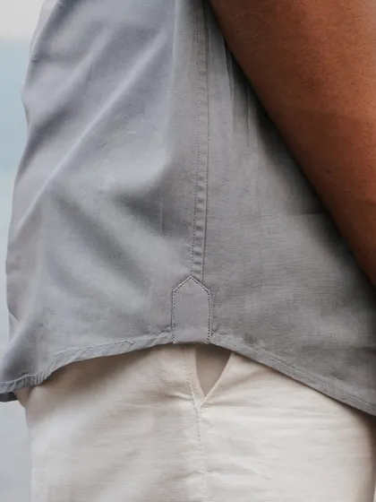 A detail shot of the 'Soaring Whale' shirt, showing the clean finish and quality stitching alongside the intricate embroidery.