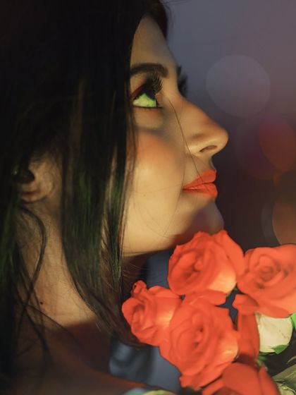 A beautiful profile shot against a backdrop of blurred city lights. The bokeh and soft focus add to the magical, twilight feel of the portrait.