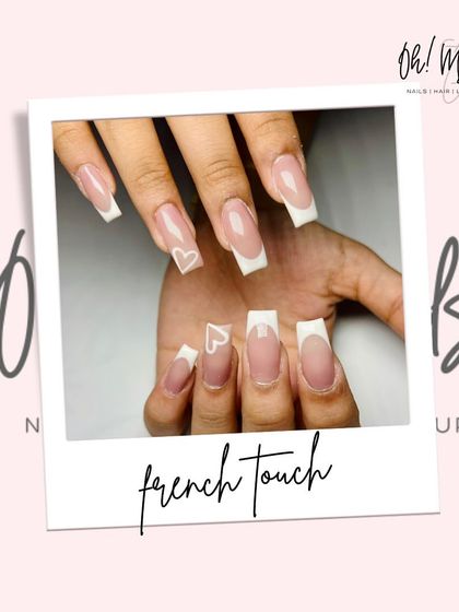 Minimal, clean, and effortlessly pretty. This classic square-tipped French manicure is given a sweet touch with a simple, hand-drawn heart outline on the ring finger.