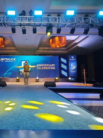 A clean, professional setup for a corporate anniversary celebration. The stage features a large LED screen for branding and presentations, flanked by a powerful sound system, all designed to create a premium awards night experience.