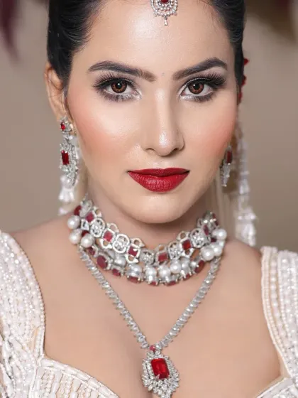A close-up of the classic red lip look, showing the precision in the lip line and the flawless skin. These are fundamental skills for any pro makeup artist.