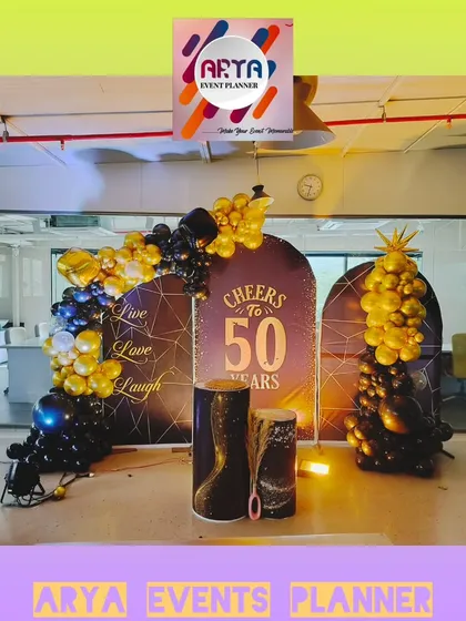 For the 50th anniversary of Paras Defence in MIDC Nerul, we created this celebratory photo corner right inside their office. The setup features custom backdrops and elegant black and gold balloon arrangements to mark the corporate milestone.