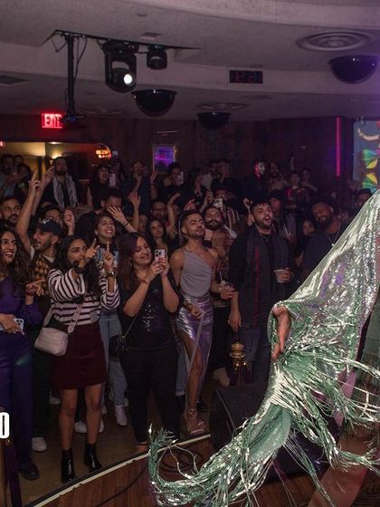 A performer owning the stage at our Thanksgiving edition of Bollywood Disco. I curate my events to include dynamic live performances that elevate the party experience.