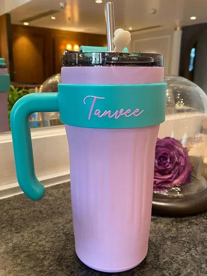 A beautiful pastel combination of our thirst trap tumbler. The lilac and teal colors look so dreamy together, and it's personalised with the name 'Tanvee'.