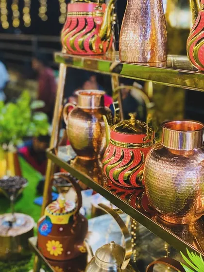A collection of ornate, hand-painted and copper teapots, part of the beautiful decor at my beverage station.