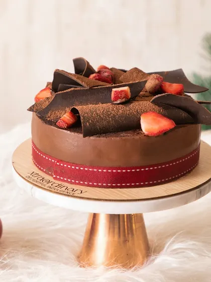 My Strawberry Mousse Cake is a holiday favorite, featuring rich chocolate, fresh strawberries, and delicate chocolate shavings.