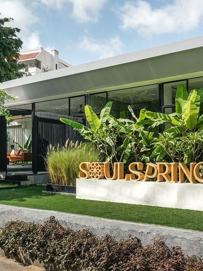 A duplicate exterior view of Soul Spring under bright sunlight.