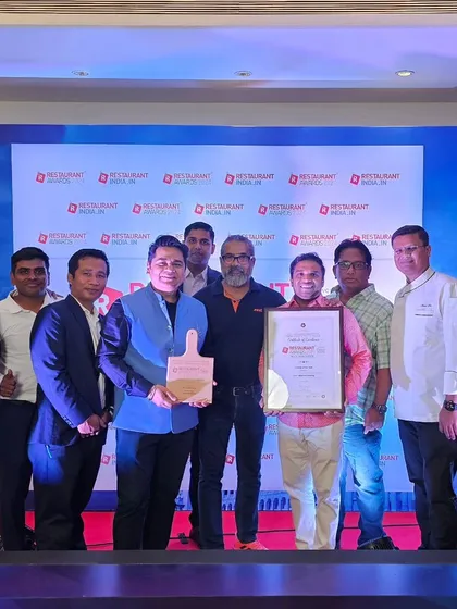 Our team posing with the "Caterer of the Year" award.