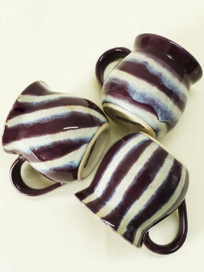 Tumbled together, the Alluring Amethyst cups showcase their vibrant, glossy finish. These are wheel-thrown and designed to be both beautiful and durable for everyday use.