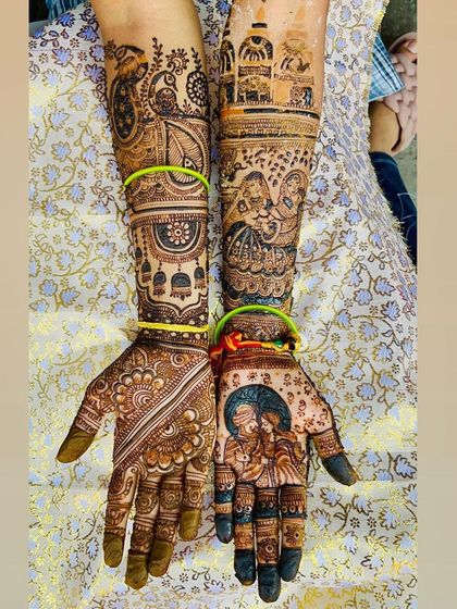 This design beautifully captures a family's story. It includes a couple portrait, figures of a brother and sister, and traditional motifs, all woven together into a single piece of art.