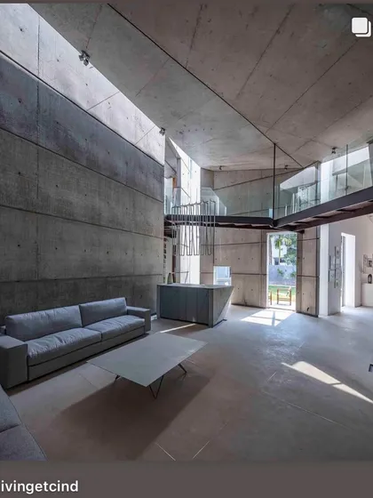 The interior of the 'House of Stories' in Bengaluru, a space designed for an author. We used raw, board-formed concrete not as a backdrop, but as a primary material, sculpting it to catch and hold light in ways that create moments of quiet and deep nuance.