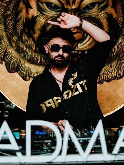 Rocking the inverted 'Oppozit' shirt in front of the iconic Badmaash tiger. The brand is strong.