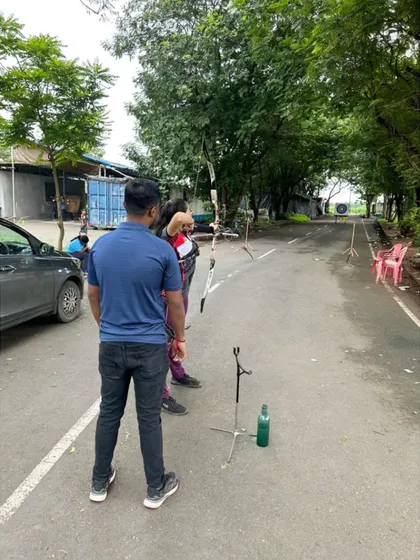 Training can happen in various settings. In this image, I'm supervising a student's practice, focusing on consistency and form even outside the formal range.