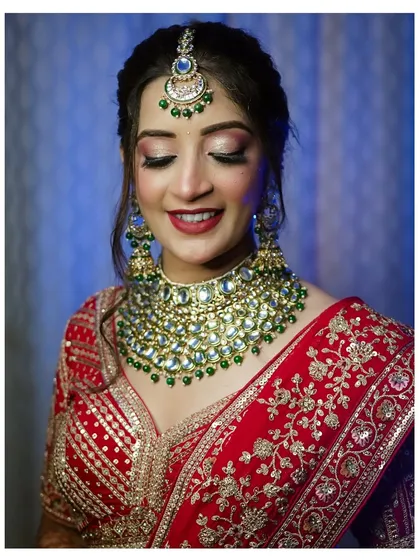 A beautiful portrait with soft, dreamy lighting. The bride's gentle smile and closed eyes convey a sense of peace and happiness on her wedding day.