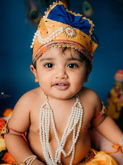 A beautiful portrait of our Bal Gopal, looking directly at the camera with a sweet and innocent expression.