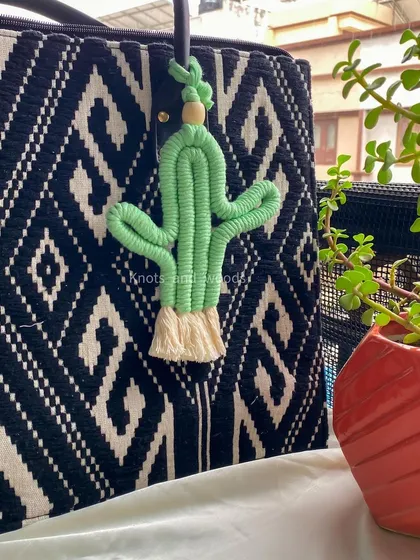 For something a little different, how about this cute macrame cactus charm? It's a fun and quirky accessory to personalize your keys or bag.