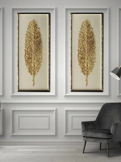 This pair of shadow boxes features tall, elegant golden feathers. The intricate, textured detail of the feathers creates a luxurious and timeless look, perfect for a sophisticated living space.