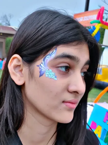 A beautiful abstract butterfly design in purple and blue, with a touch of silver glitter.