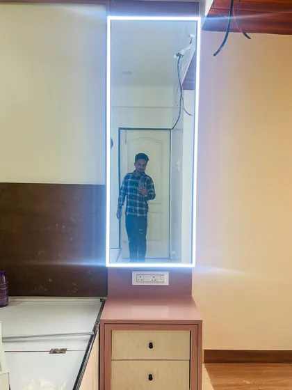 A close-up of a vanity mirror with integrated LED backlighting, providing perfect, shadow-free light for getting ready.