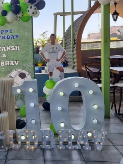 A close-up of the marquee numbers and player cutout at the football party.
