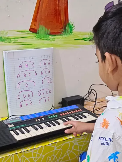 A young fan of the 'Bhool Bhulaiyaa' song learns the notes. We love teaching kids the songs they are excited about, making practice more enjoyable.