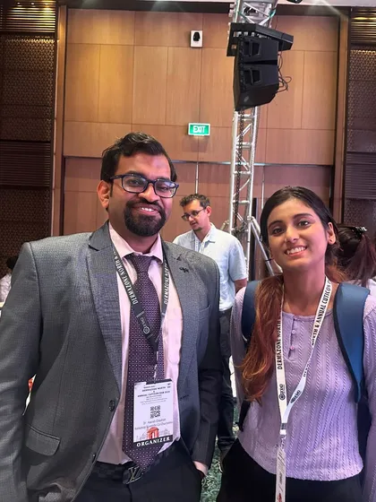A candid moment with a junior colleague after a paper presentation. Mentoring the next generation of dermatologists is something I am very passionate about.