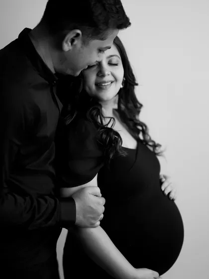 A timeless black and white photo capturing a moment of pure bliss. The way he holds her and her joyful expression says everything about their love.