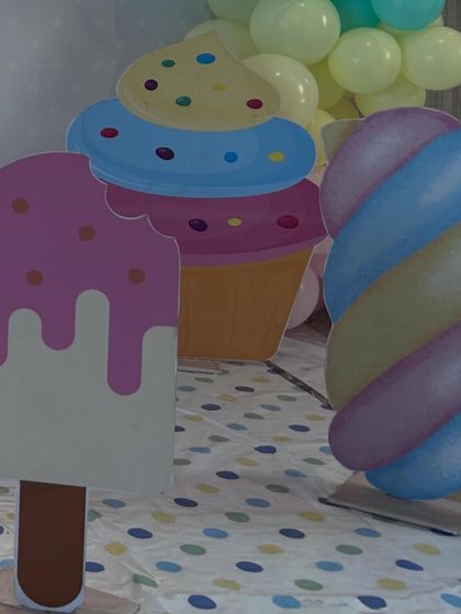 A close-up of our custom-made props for the candy theme, including an ice cream pop, a cupcake, and a marshmallow twist.