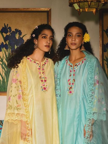 A lovely shot of two models for Baavli, showcasing complementary outfits in pastel shades. It tells a story of friendship and celebration.