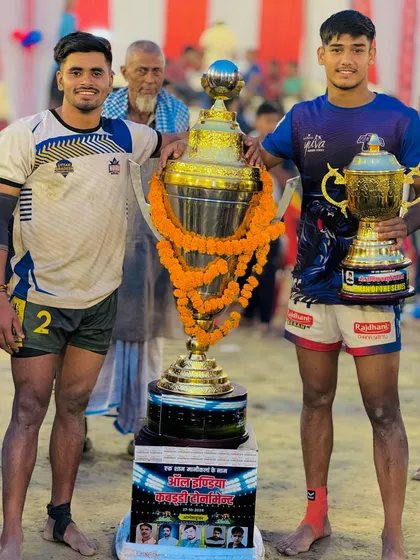 Our players celebrating a double victory: winning the tournament and one of our own being named Best Player of the Tournament.
