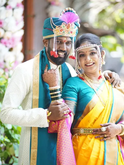 A classic wedding portrait. The bride's makeup is flawless, and her smile says it all.