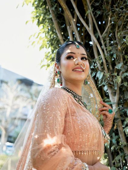 A close-up of the minimal makeup look. The soft, shimmery eyes and pink nude lipstick create an effortlessly elegant vibe.