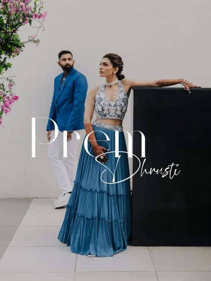 A stylish, editorial-style portrait of a couple at their pre-wedding carnival party.