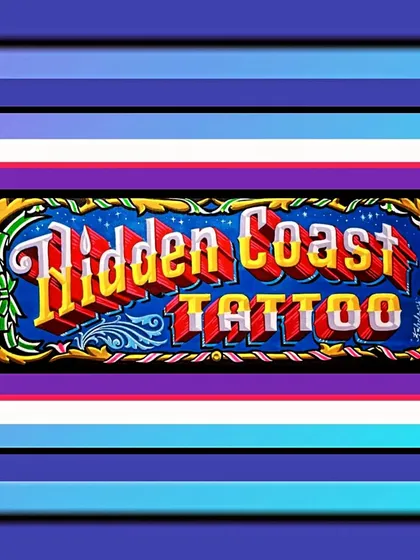 A sign for Hidden Coast Tattoo, also for Nathan Glomb. The letters have a beautiful gradient, set against a deep blue background with starry details.