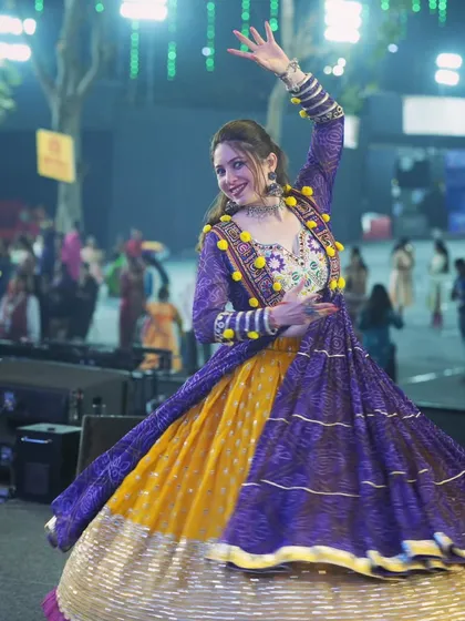Flaring in this beautiful multi-colored outfit for Day 8 of Navratri. The right outfit is essential for stage presence.