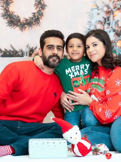 A festive family portrait from our Christmas mini sessions. We encourage coordinating outfits to match the holiday theme and create a perfect picture for your holiday cards.