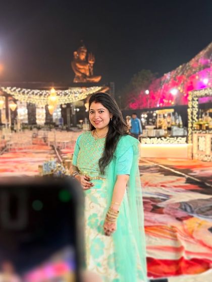 A candid moment captured at a grand wedding venue. I am always present at events to guide my clients, making sure they feel confident and ready before they step onto the dance floor.