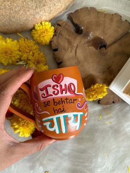 A close-up of the "Ishq se behtar hai Chai" terracotta mug, a sentiment many tea lovers can agree with.