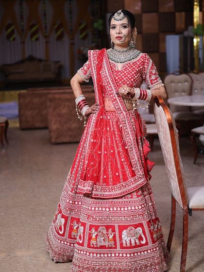 A full-length portrait showcasing the bride's entire look in the wedding venue.