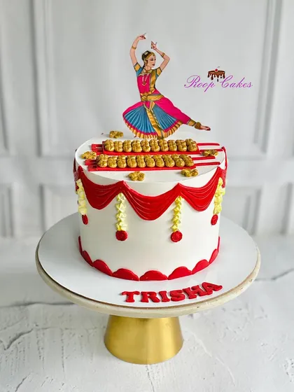 A stunning Bharatanatyam-themed cake, adorned with intricate classical dance elements and vibrant decorations for a graceful celebration.