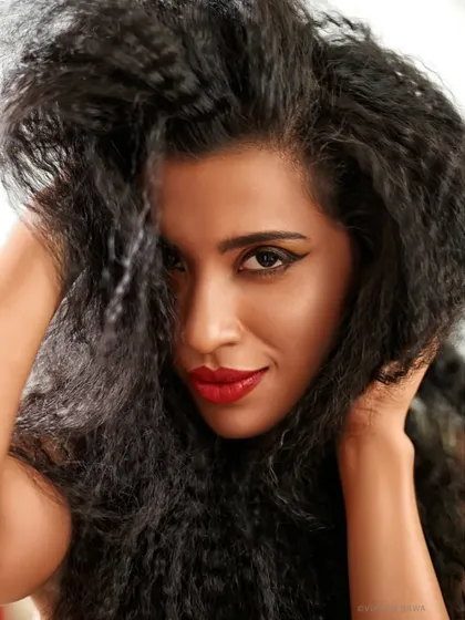 Radiant beauty, captured naturally. This portrait from a photography workshop focuses on the model's expressive face and incredible hair texture.