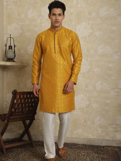 Another option for a Haldi function, this mustard yellow kurta has a subtle texture that adds to its charm.