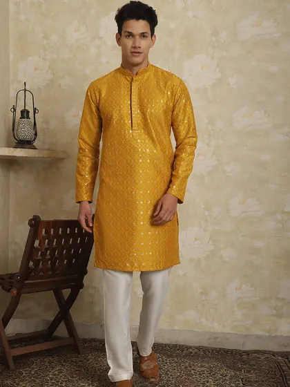 Explore my complete collection of kurta-pajama-jackets for your Haldi ceremony. This mustard yellow embroidered kurta is a perfect choice.