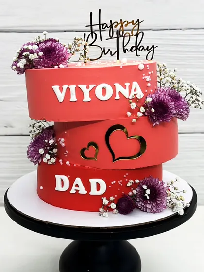 Another view of the topsy-turvy cake for my dad and Viyona, with a 'Happy Birthday' topper.
