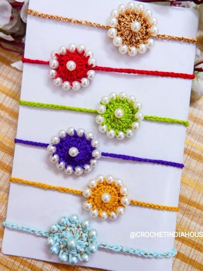 These pearl rakhis come in a rainbow of colors, from bright red and yellow to cool blue and purple. Each one is carefully handmade to be a special part of your Rakshabandhan.