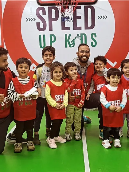 A happy group of our youngest athletes with their coaches. This is what our 'Sports for All' philosophy looks like in practice.
