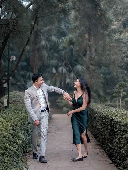 A playful, walking shot on a garden path. The candid interaction and natural smiles are what I strive to capture in every pre-wedding photoshoot.