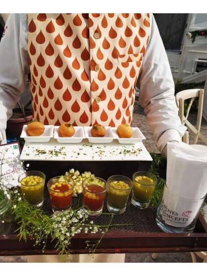 Our modern take on golgappas, presented on a custom tray with individual shot glasses of spicy and sweet water. This presentation is always a conversation starter and a highlight of our innovative Indian menu.