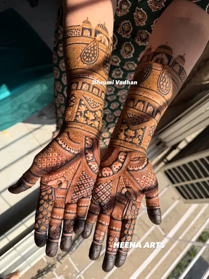 A gorgeous design for the groom's mom, featuring domes and paisleys, covering the hands and forearms in rich detail.