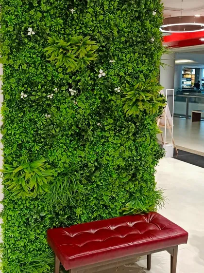 A breath of nature within refined walls. This verdant green wall in a retail space offers a moment of serenity and sophistication for shoppers.